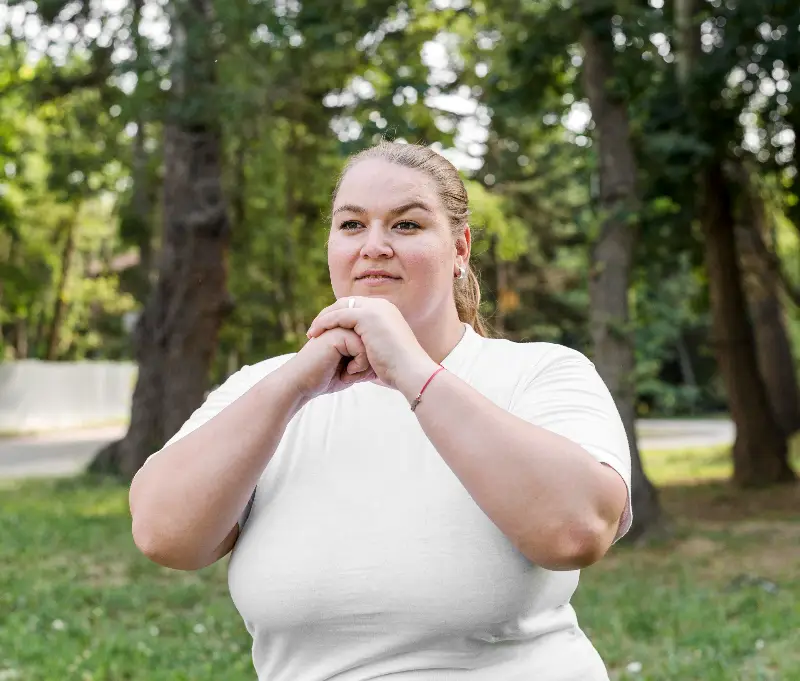 Woman exercising in a park